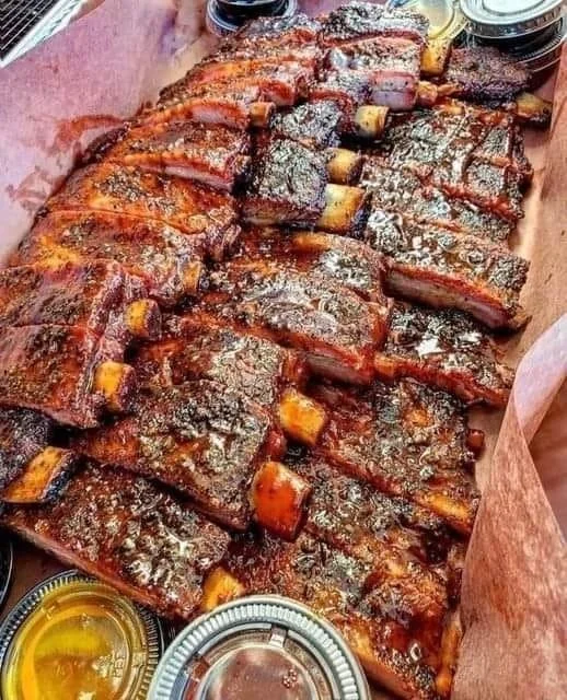 Delicious barbecue ribs served with coleslaw and baked beans.