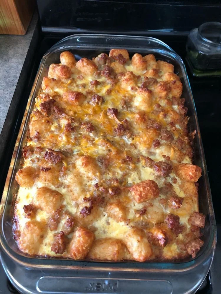 Delicious Sausage Tater Tot Casserole topped with golden crispy tater tots