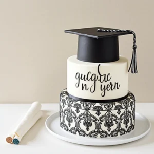 A collection of beautifully decorated graduation cakes, featuring caps, diplomas, and school colors.