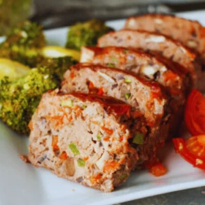 Golden-brown meatloaf fresh out of the oven, topped with a tangy ketchup glaze