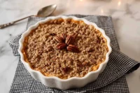Slow Cooker Sweet Potato Casserole topped with pecans and brown sugar crumble