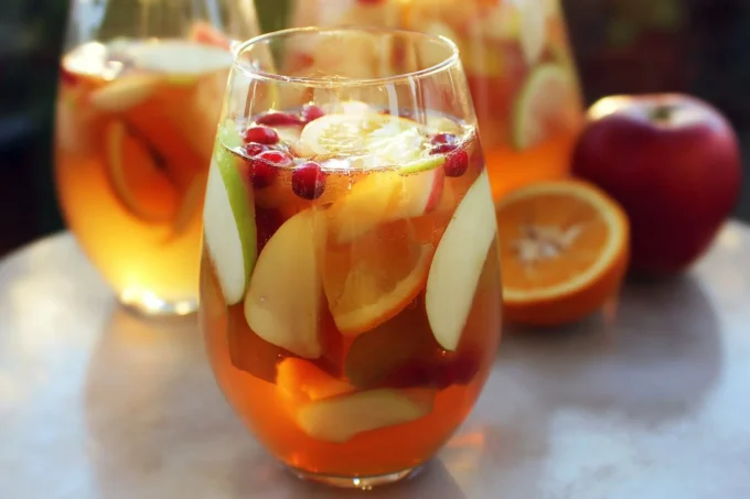 Delicious Apple Cider Sangria in a glass with fresh fruit slices