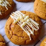Chewy maple cinnamon cookies with white chocolate drizzled on top