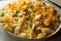 Delicious Chicken Noodle Casserole served in a baking dish with fresh parsley