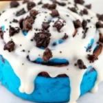 Freshly baked chocolate cinnamon rolls drizzled with chocolate glaze