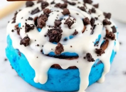 Freshly baked chocolate cinnamon rolls drizzled with chocolate glaze