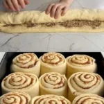 Freshly baked cinnamon rolls with cream cheese frosting