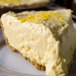 Cream Cheese Lemonade Pie topped with fresh lemon slices and whipped cream