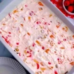 A refreshing bowl of colorful frozen fruit salad with various fruits.