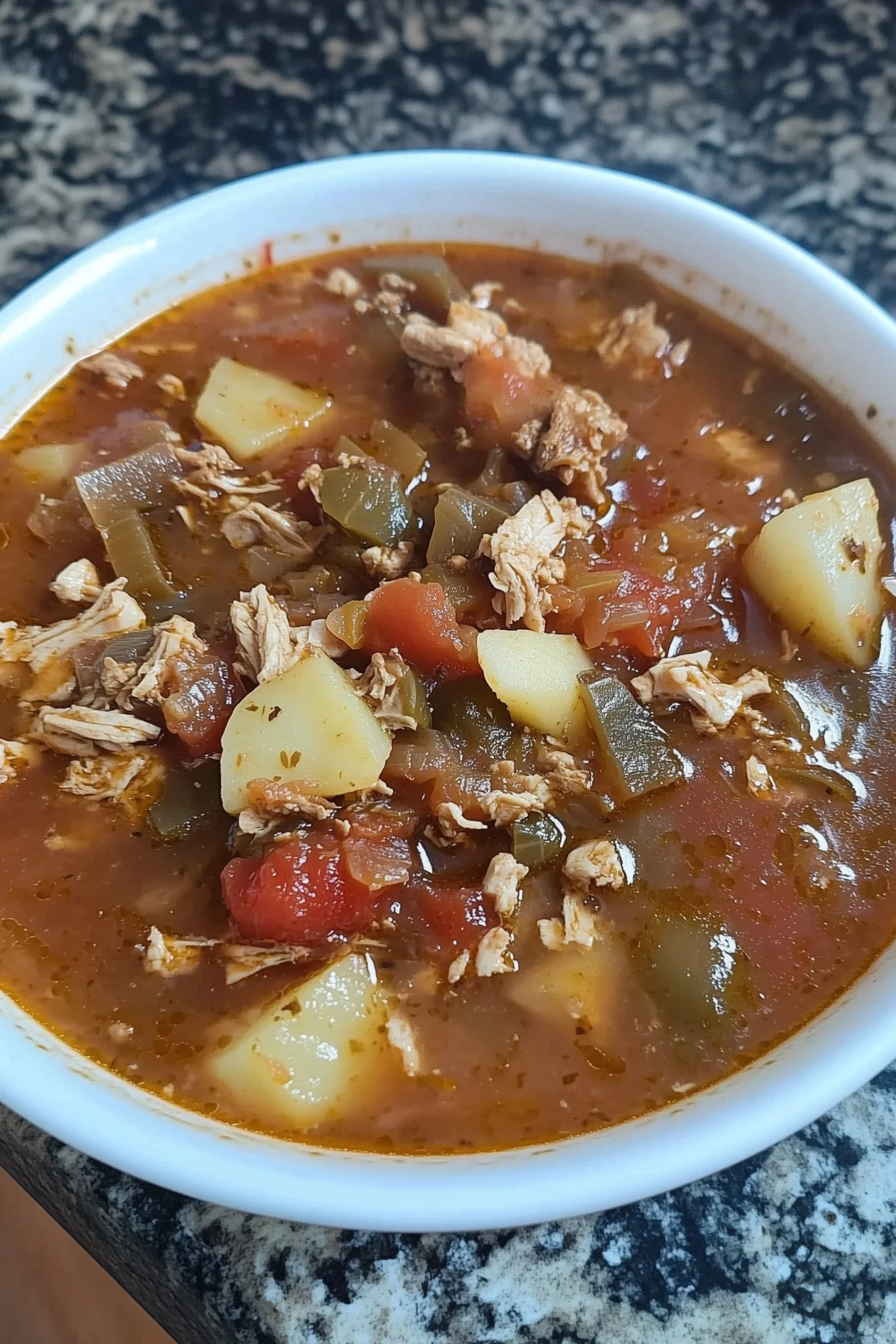 Delicious green chile chicken enchilada casserole topped with cheese and cilantro