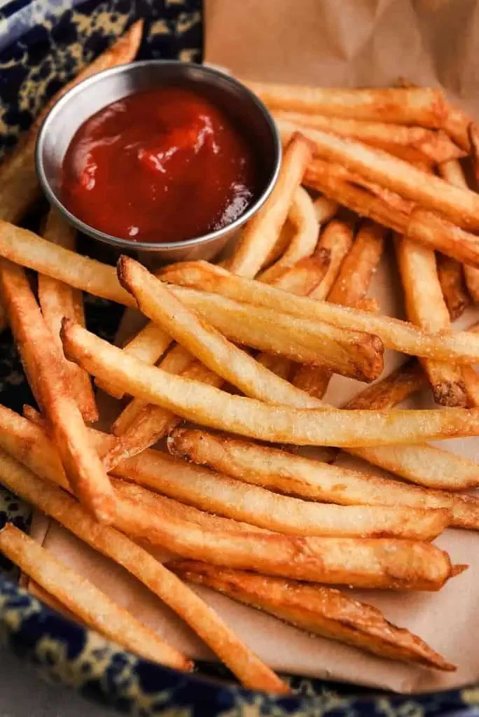 Delicious homemade French fries served hot and crispy on a plate