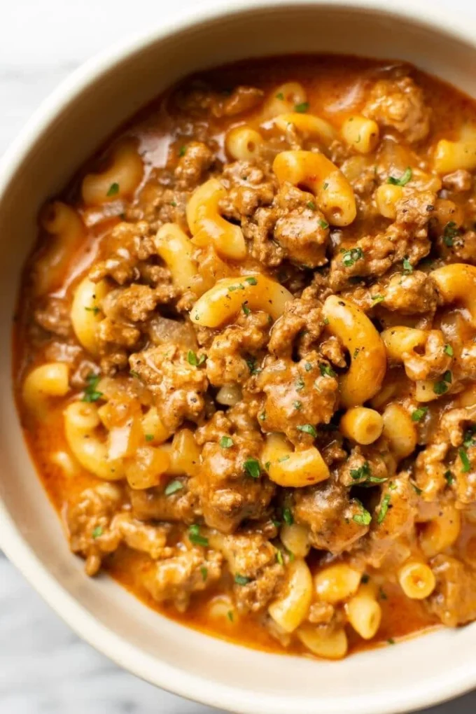 A bowl of homemade Hamburger Helper featuring pasta and ground beef.