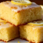 Delicious Lemon Brownies (Lemonies) served on a plate, showcasing their vibrant yellow color.