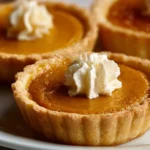 Delicious mini pumpkin pies served on a festive table