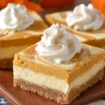 Delicious pumpkin cheesecake bars with a creamy topping and a spiced crust.