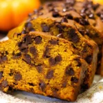 Delicious slice of Pumpkin Chocolate Chip Bread with chocolate chips and pumpkin spice