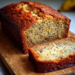 Delicious slice of rich banana bread topped with walnuts