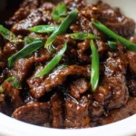 Slow Cooker Mongolian Beef dish with tender beef and savory sauce