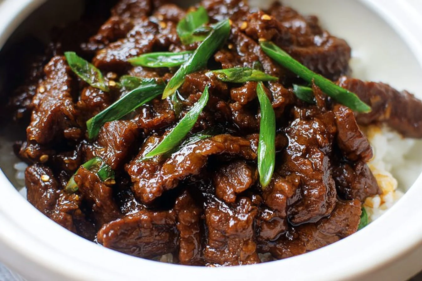 Slow Cooker Mongolian Beef dish with tender beef and savory sauce