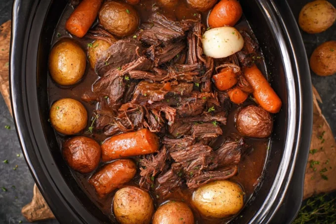 Delicious slow cooker pot roast with vegetables ready to serve.