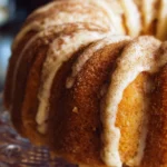 Homemade snickerdoodle bundt cake topped with cinnamon sugar glaze