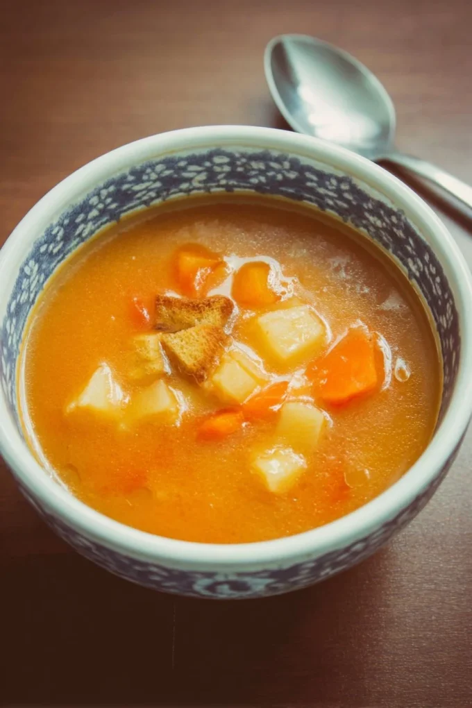 Bowl of homemade vegetable soup with fresh ingredients