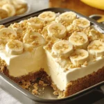 Delicious banana cream dessert topped with whipped cream and banana slices