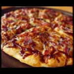 Delicious Barbecue Bacon Pizza topped with smoky flavors and crispy bacon.