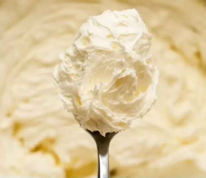 Delicious buttercream icing on vanilla and chocolate cupcakes
