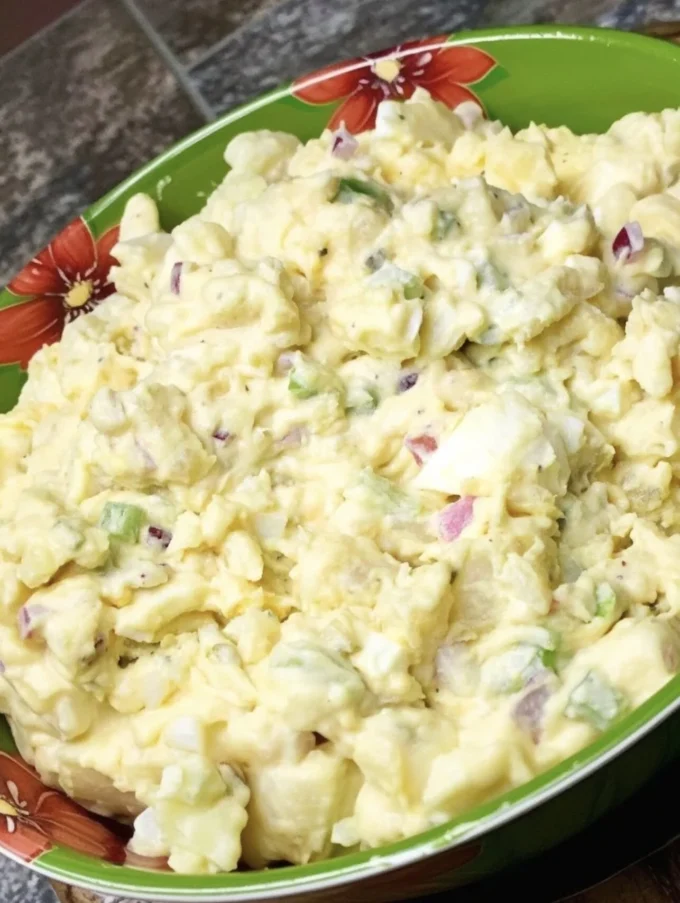 Bowl of Classic Southern Potato Salad with creamy dressing and herbs