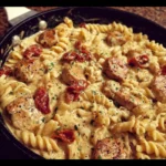 Creamy Pepper Jack Chicken and Sausage Pasta Skillet dish served in a bowl