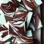 Delicious easy chocolate mint fudge stacked on a plate