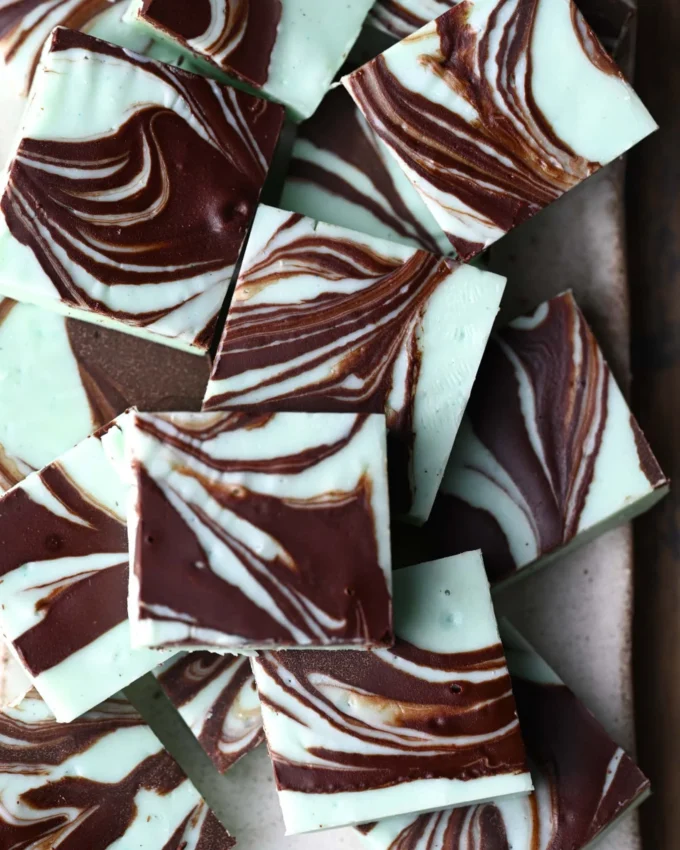 Delicious easy chocolate mint fudge stacked on a plate