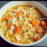 Bowl of easy Turkey Noodle Soup with vegetables and noodles