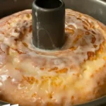 Slice of famous pound cake on a plate with strawberries