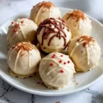 Decadent gingerbread truffles dusted with sugar and decorated for the holidays.