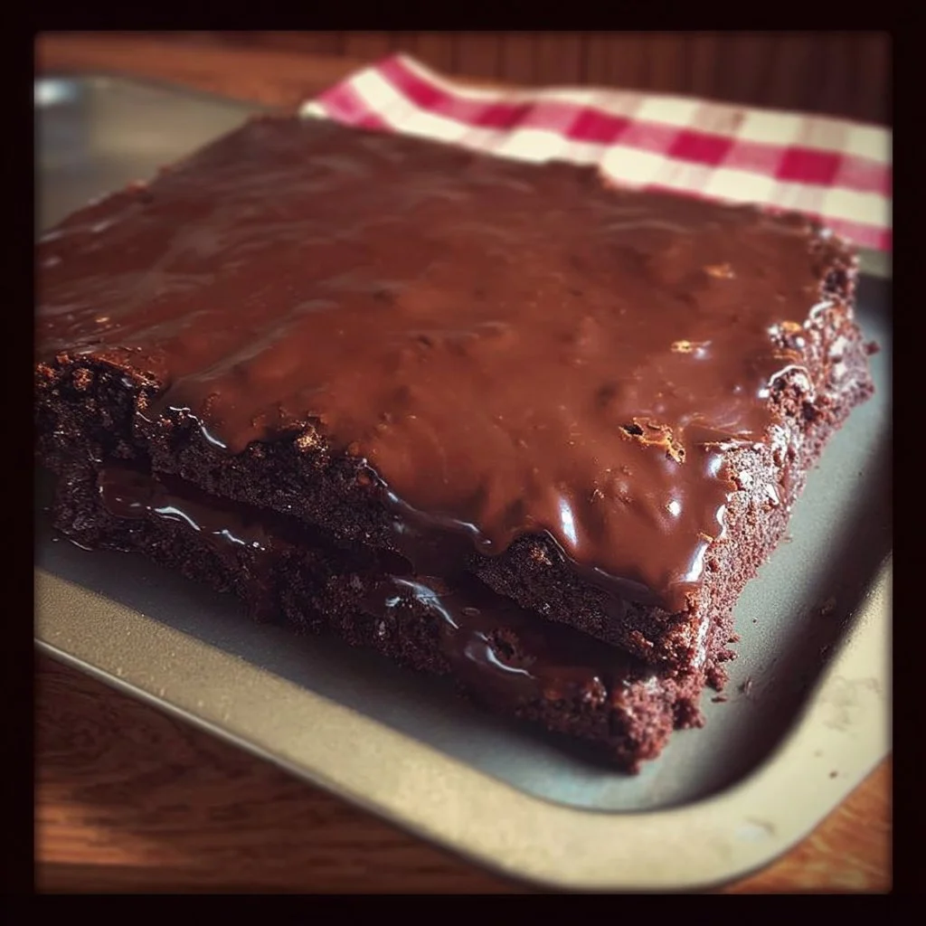 Delicious HERSHEY’S syrup brownies topped with chocolate drizzle.