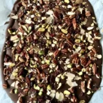 Nutty chocolate bark with assorted nuts and chocolate drizzles