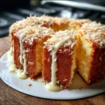 Sliced Pineapple Cream Cheese Pound Cake on a plate garnished with fresh pineapple.