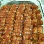 Plate of delicious Bacon-Wrapped Smokies served as a tasty appetizer.