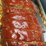 Delicious meatloaf with a savory topping, perfect for family meals.