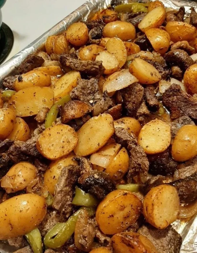 Juicy NY Strip Steak served with baby golden potatoes on a plate