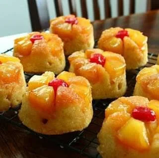 Freshly baked Pineapple Upside-Down Muffins with caramelized pineapple topping