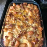 Delicious Sausage Tater Tot Casserole topped with golden crispy tater tots