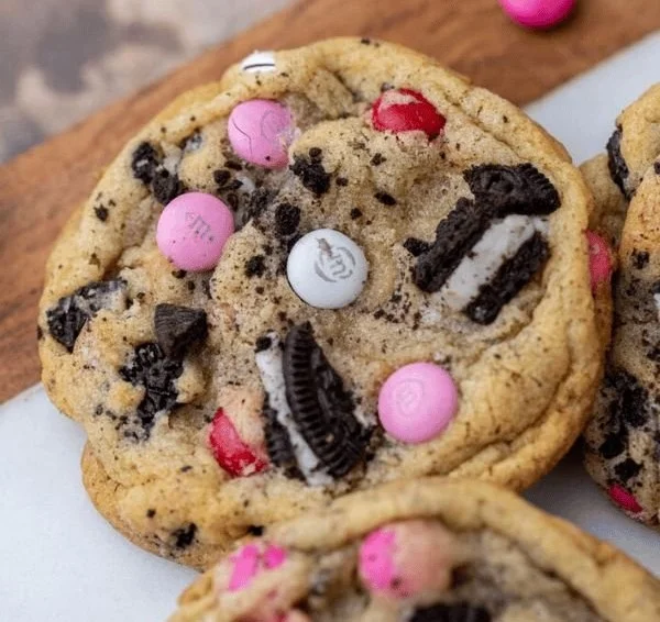 Heart-shaped Valentine's Day cookies decorated with icing and sprinkles.