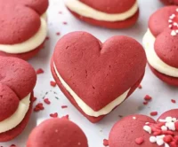 A plate of homemade whoopie pies filled with creamy frosting