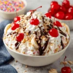 Delicious Banana Split Fluff Salad served in a bowl with fresh fruits and whipped cream.