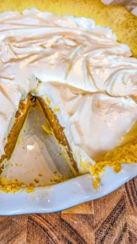 Creamy homemade butterscotch pie topped with whipped cream