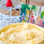 Delicious homemade buttercream frosting in a bowl with a spatula