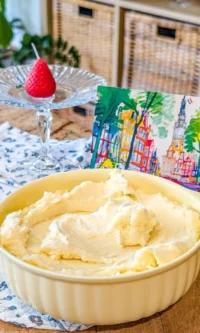 Delicious homemade buttercream frosting in a bowl with a spatula